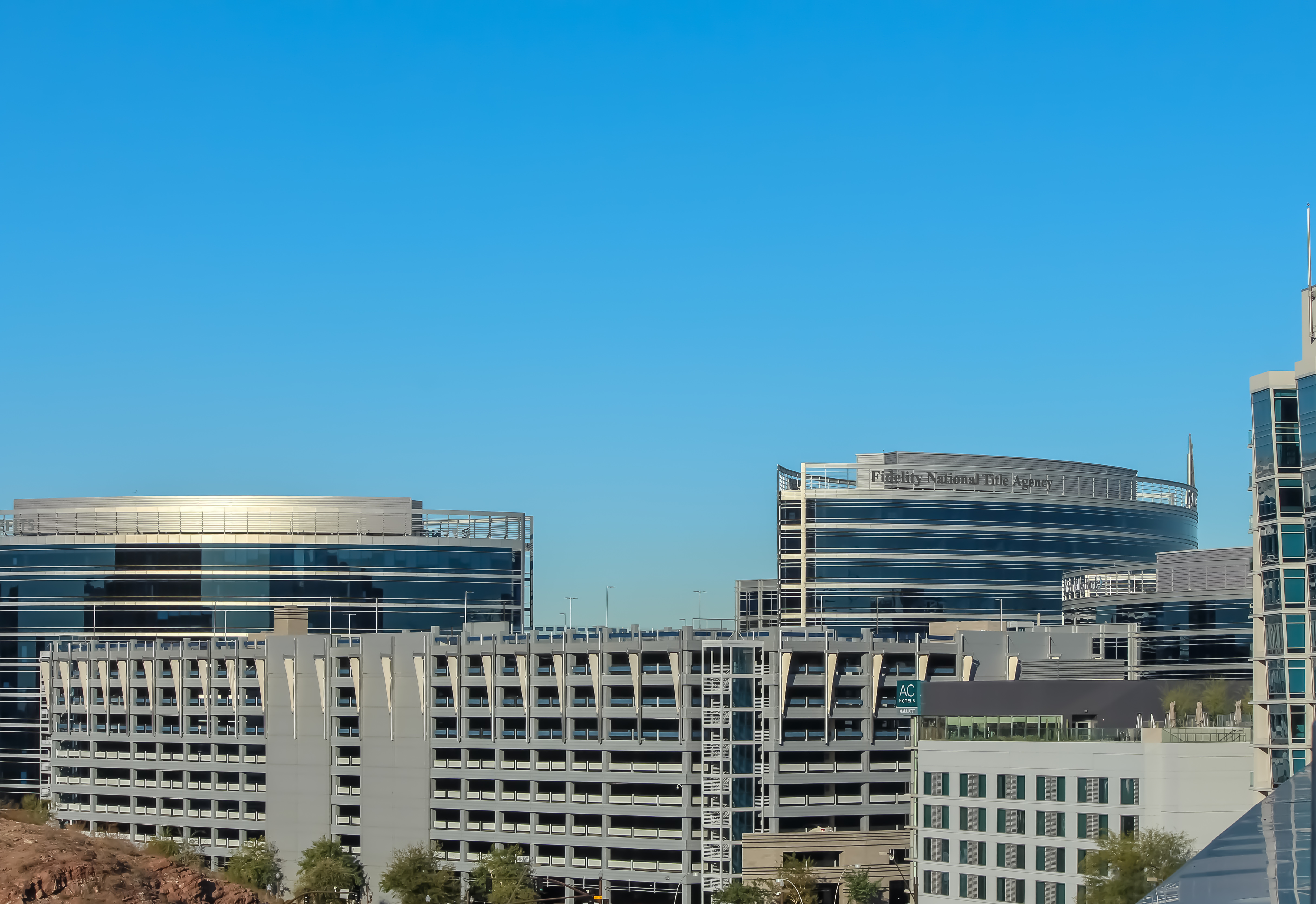 A modern office meeting room with a conference table and chairs.